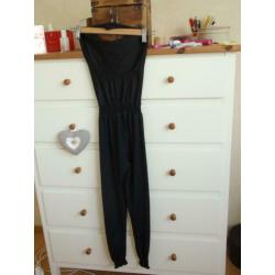 Girls: Supermooie Zwarte Jumpsuit maat 104/110